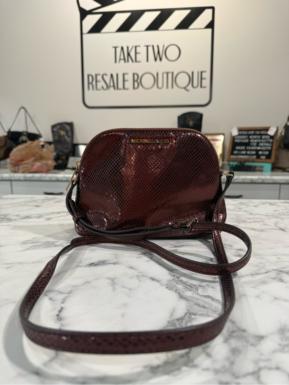 Michael Kors Adele Dome Embossed Leather Crossbody Bag color Metallic Merlot